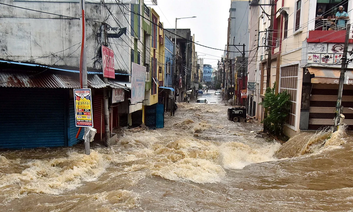 Watch: Man swept away, cars damaged as torrential rain batters Hyderabad