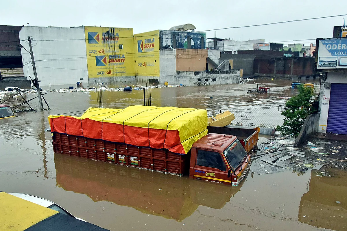 Watch: Man swept away, cars damaged as torrential rain batters Hyderabad