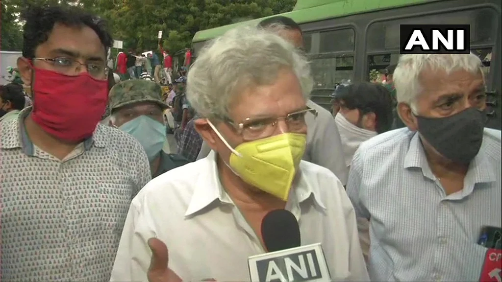 Delhi: CPM General Secretary Sitaram Yechury and CPI leader D Raja take part in a protest against Hathras incident, at Jantar Mantar.