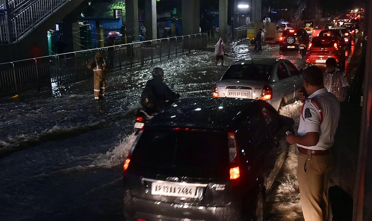Watch: Man swept away, cars damaged as torrential rain batters Hyderabad