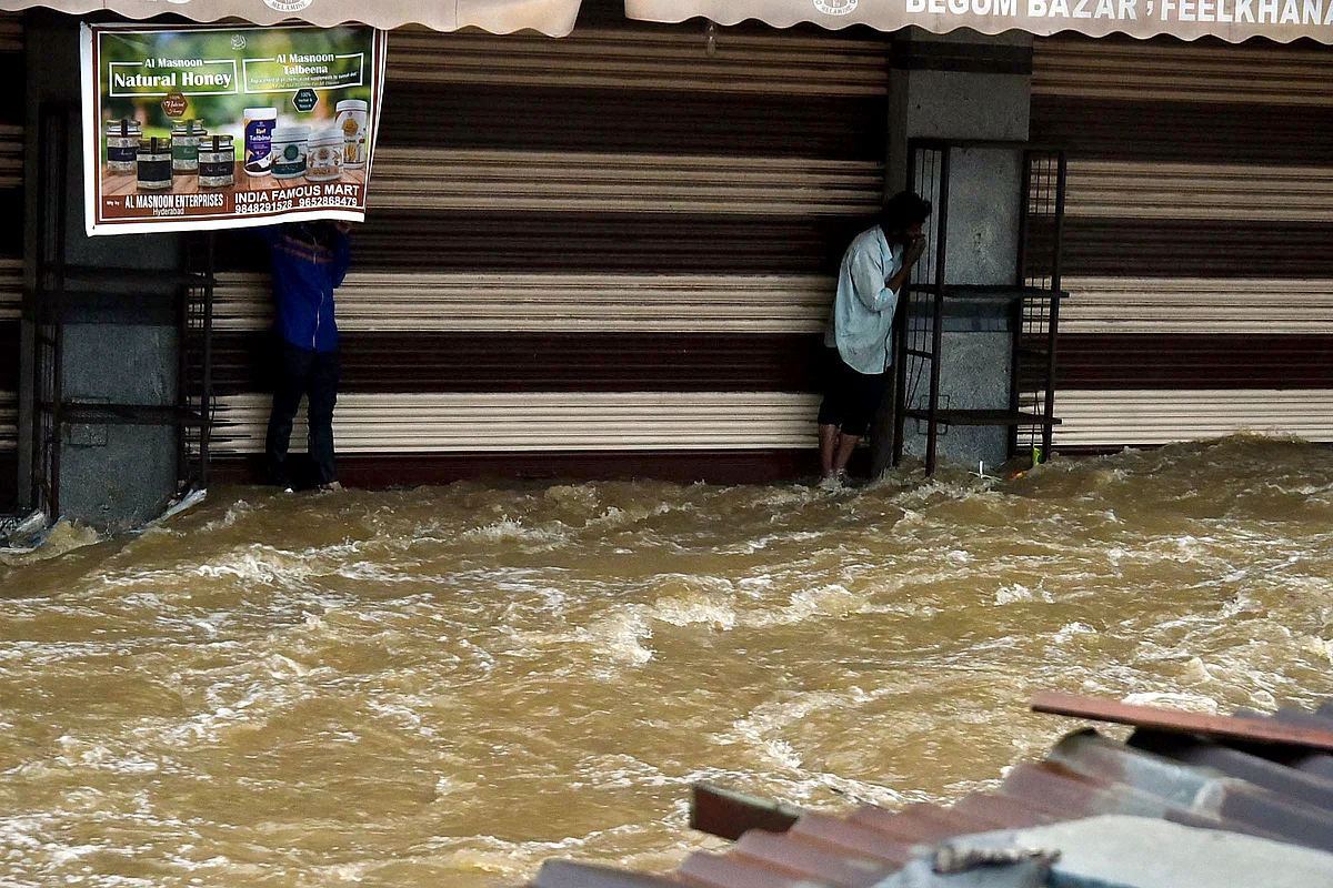 Watch: Man swept away, cars damaged as torrential rain batters Hyderabad
