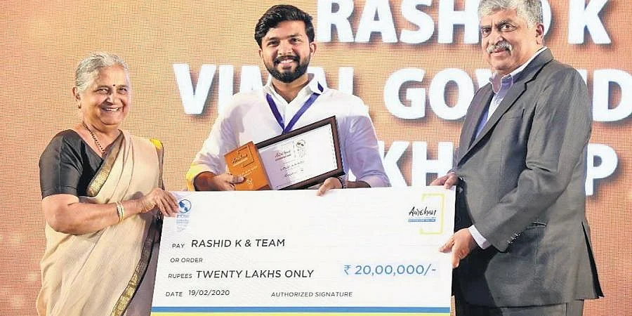 Rashid K of Genrobotics receiving a prize from Infosys Foundation
