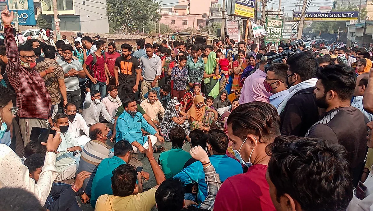 People block Ballabhgarh-Sohna road during a protest, demanding justice for Nikita Tomar