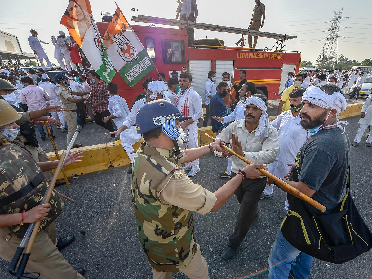 New Delhi: Police stop Congress workers attempting to cross Delhi-Noida border to move towards Hathras to meet family members of the 19-year-old woman who died after she was allegedly gang-raped, in New Delhi, Saturday, Oct. 3, 2020. Five members of a delegation led by Congress leader Rahul Gandhi have been permitted to go to Hathras via Noida.