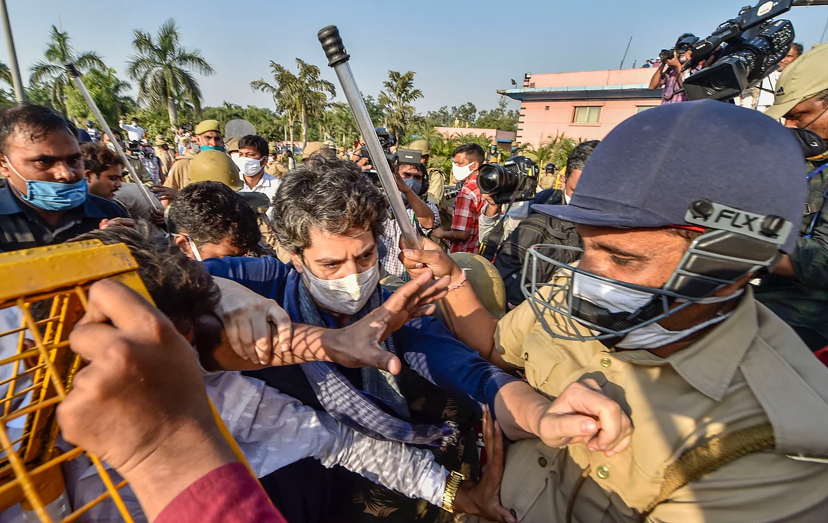 Congress leader Priyanka Gandhi Vadra helps a supporter who got injured during a lathi-charge, at Delhi-Noida flyway on Saturday. They are on their way to meet the family of the alleged gangrape victim in Hathras (UP).