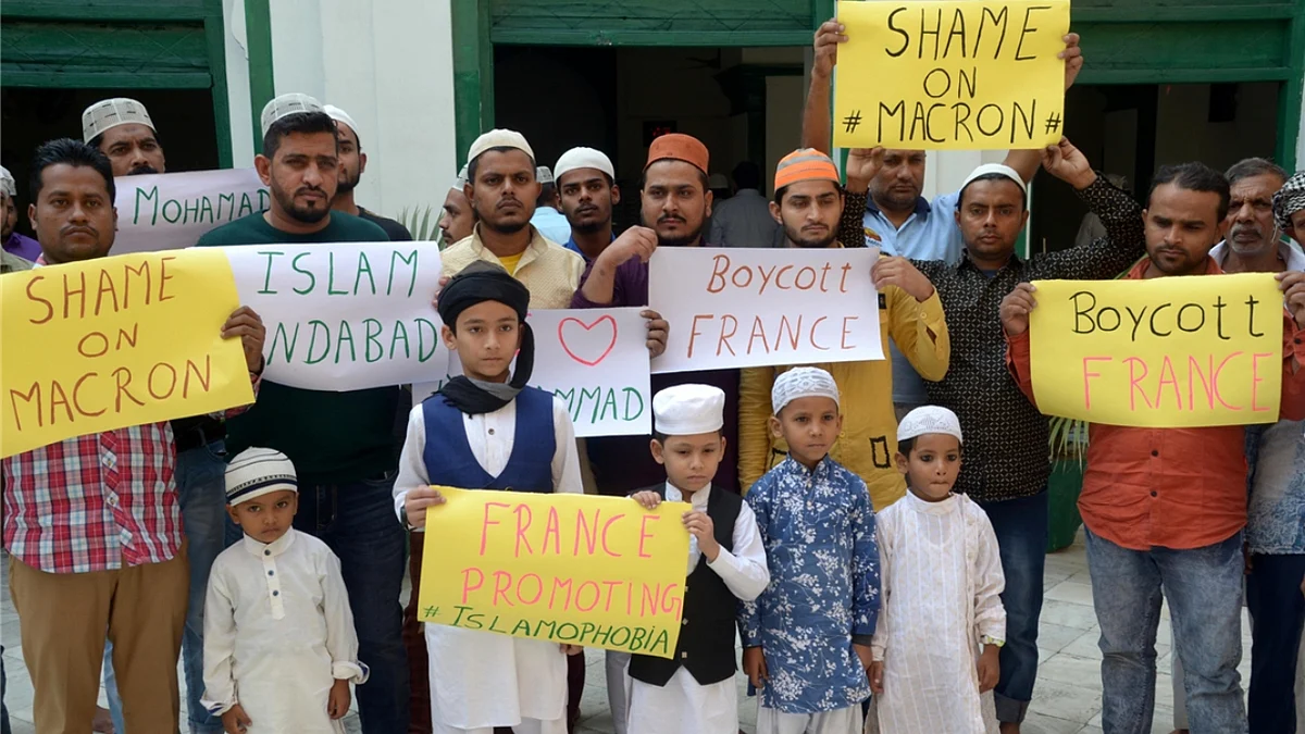 Members of the Muslim community stage a demonstration urging people to boycott France in Amritsar