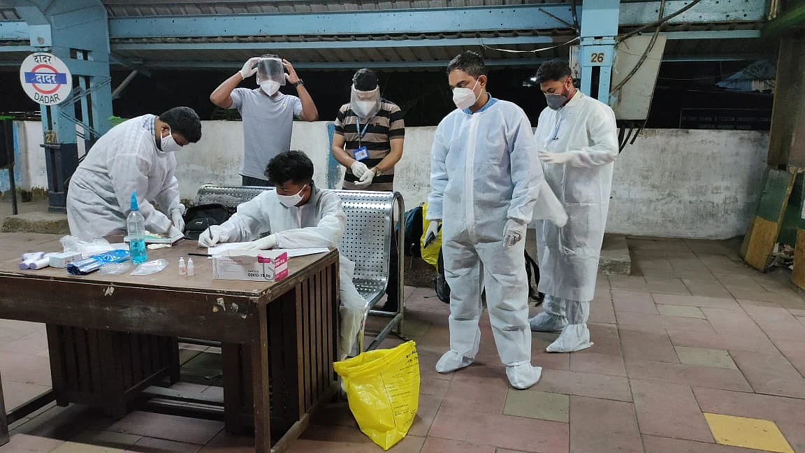Authorities screening and testing passengers at Dadar station.