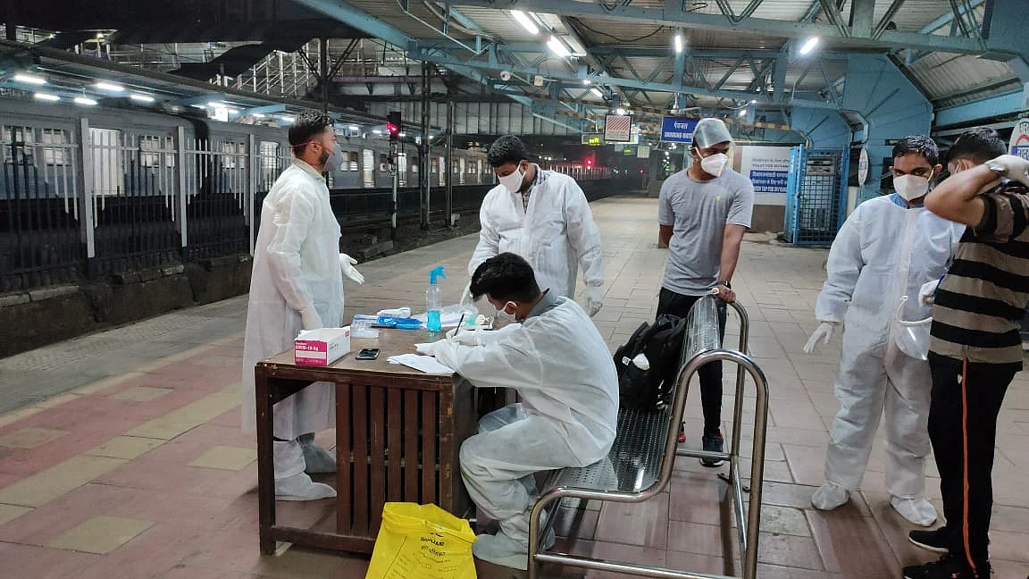 Authorities screening and testing passengers at Dadar station.