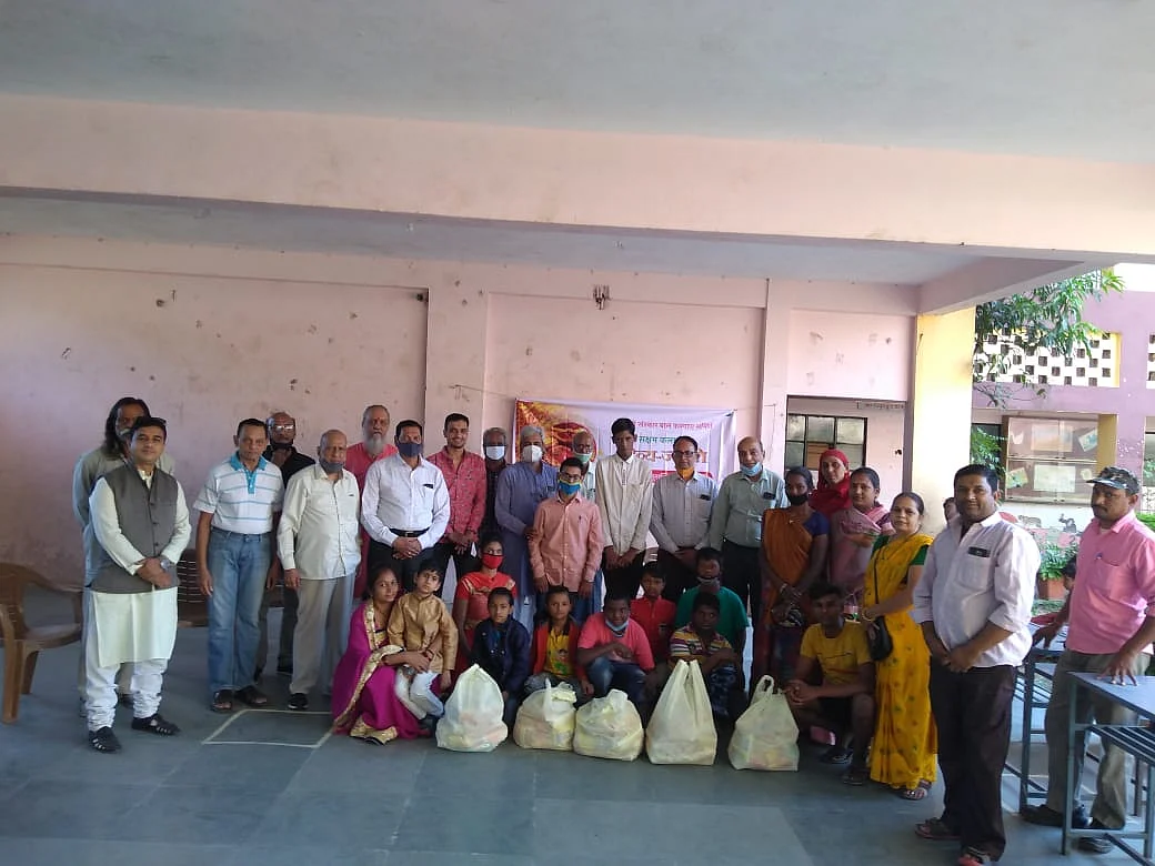 Group of youngsters with specially-abled children
