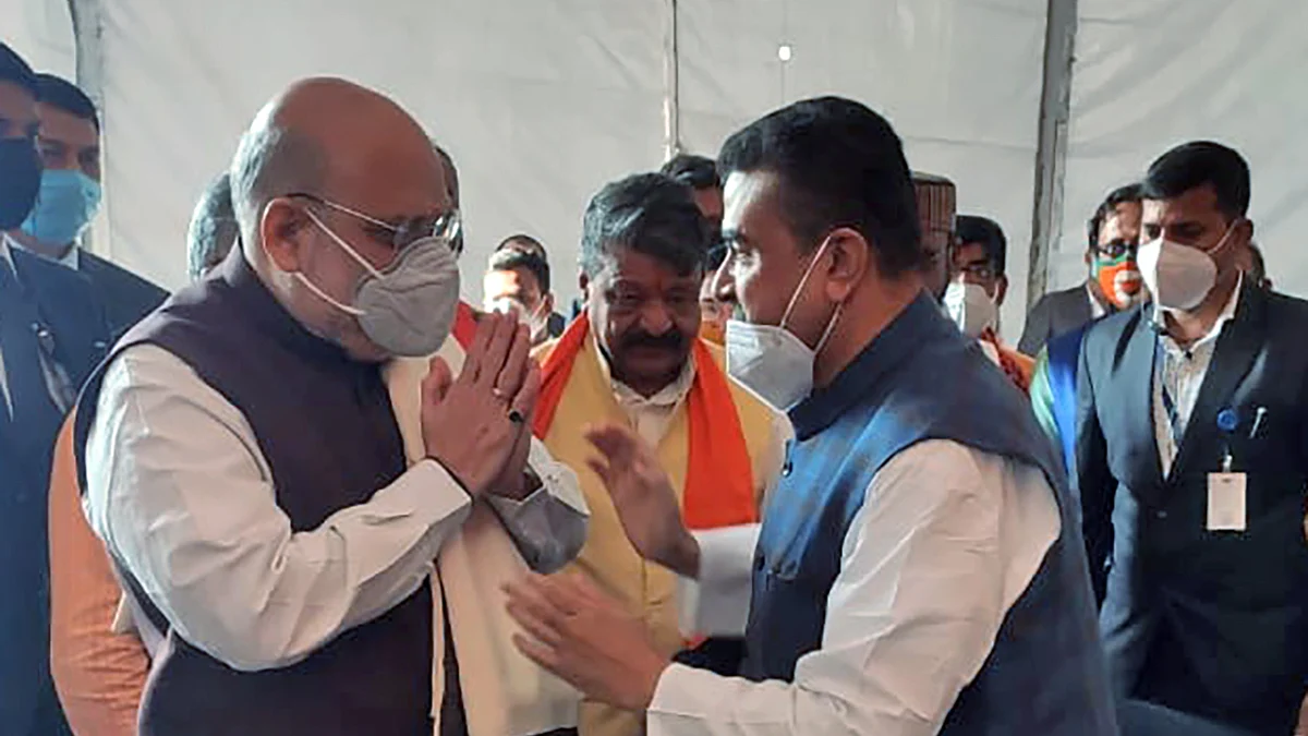 Suvendu Adhikari felicitates Home Minister Amit Shah during a public rally, at Midnapore College Ground, in Midnapore on Saturday