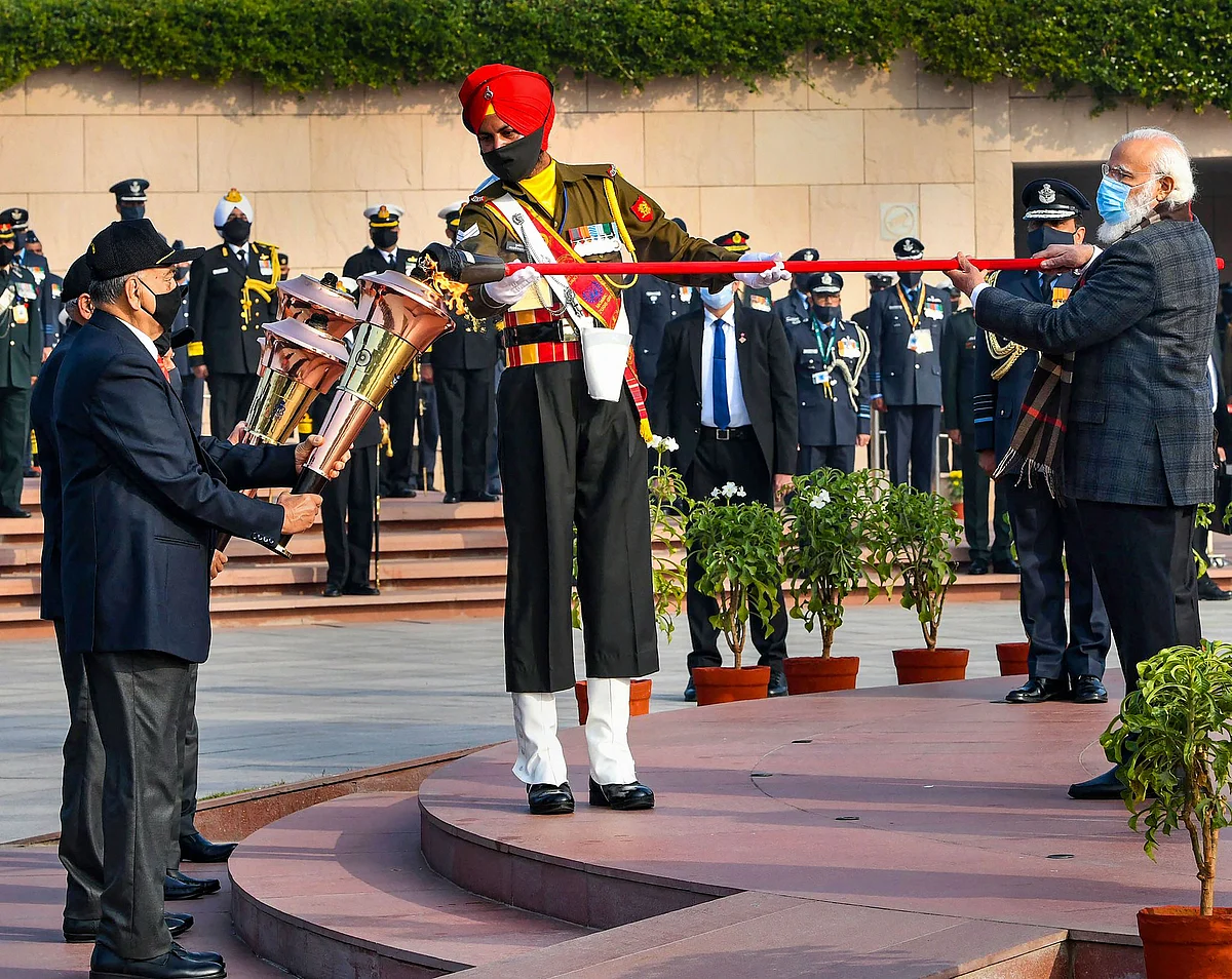 Prime Minister Narendra Modi lights the "Swarnim Vijay Mashaal" at the National War Memorial