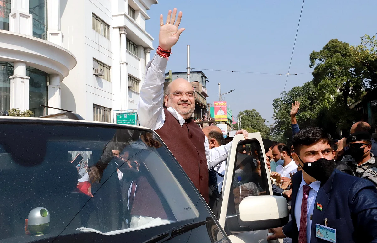 Union Home Minister Amit Shah waves to supporters during his visit to Swami Vivekanand ancestral house, in Kolkata on Saturday.