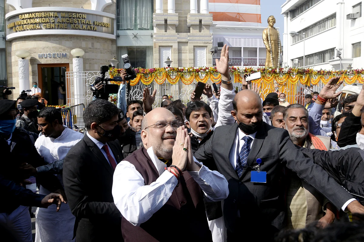 Union Home Minister Amit Shah waves to supporters during his visit to Swami Vivekanand ancestral house, in Kolkata on Saturday.