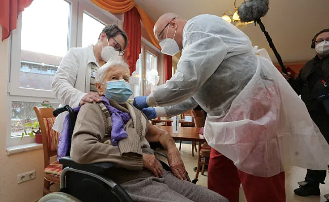 EU kicks off mass COVID-19 vaccinations even as new variant is detected in France and Spain