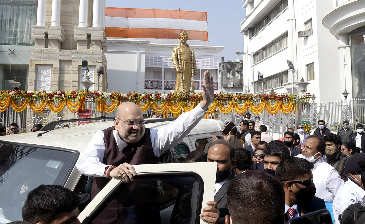 Union Home Minister Amit Shah waves to supporters during his visit to Swami Vivekanand ancestral house, in Kolkata on Saturday.