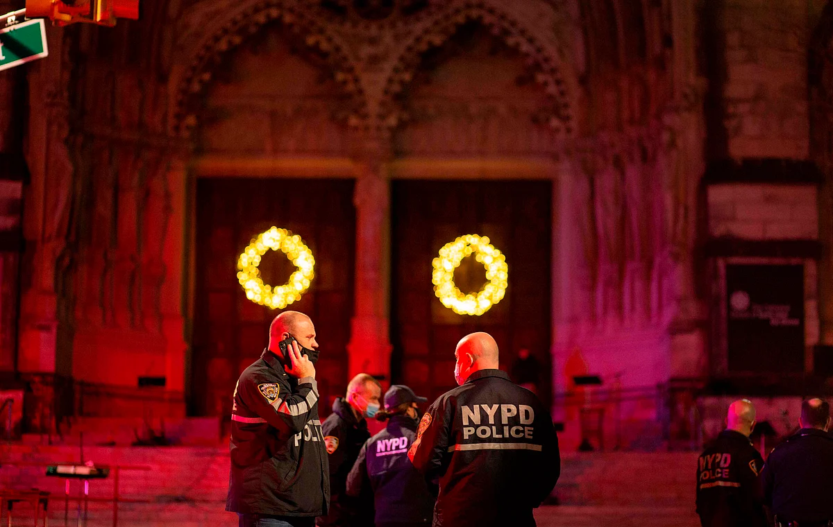 Police patrol outside of the Cathedral of St. John the Divine in New York on December 13, 2020, after a shooter opened fire outside the church