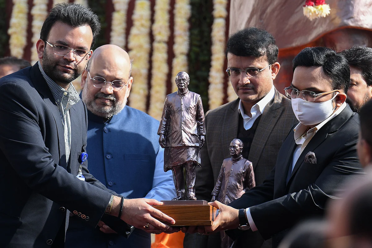 Delhi and District Cricket Association (DDCA) President Rohan Jaitley (L) presents a memento to Board of Control for Cricket in India (BCCI) Secretary Jay Shah (R) as Home Minister Amit Shah (2L) and BCCI Predident Sourav Ganguly (2R) look on during a ceremony to unveil a statue of the late Arun Jaitley, a former union minister and longtime national politician, at the Arun Jaitley Stadium sports ground in New Delhi on December 28, 2020.