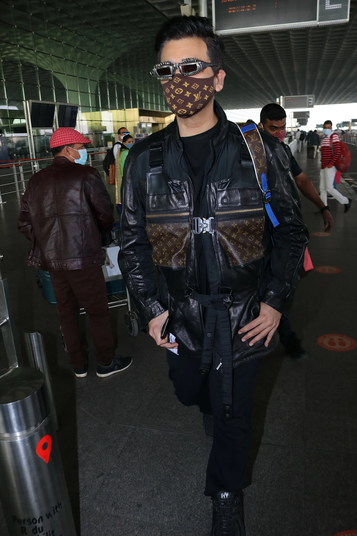 'Monkey, disaster, robot': Karan Johar trolled for his quirky Louis Vuitton airport look