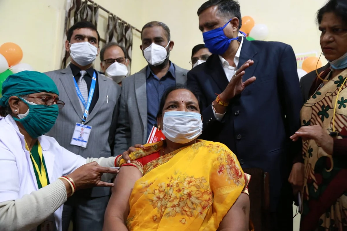 District hospital staffer Asha Pawar receiving vaccine at MY Hospital on Saturday morning