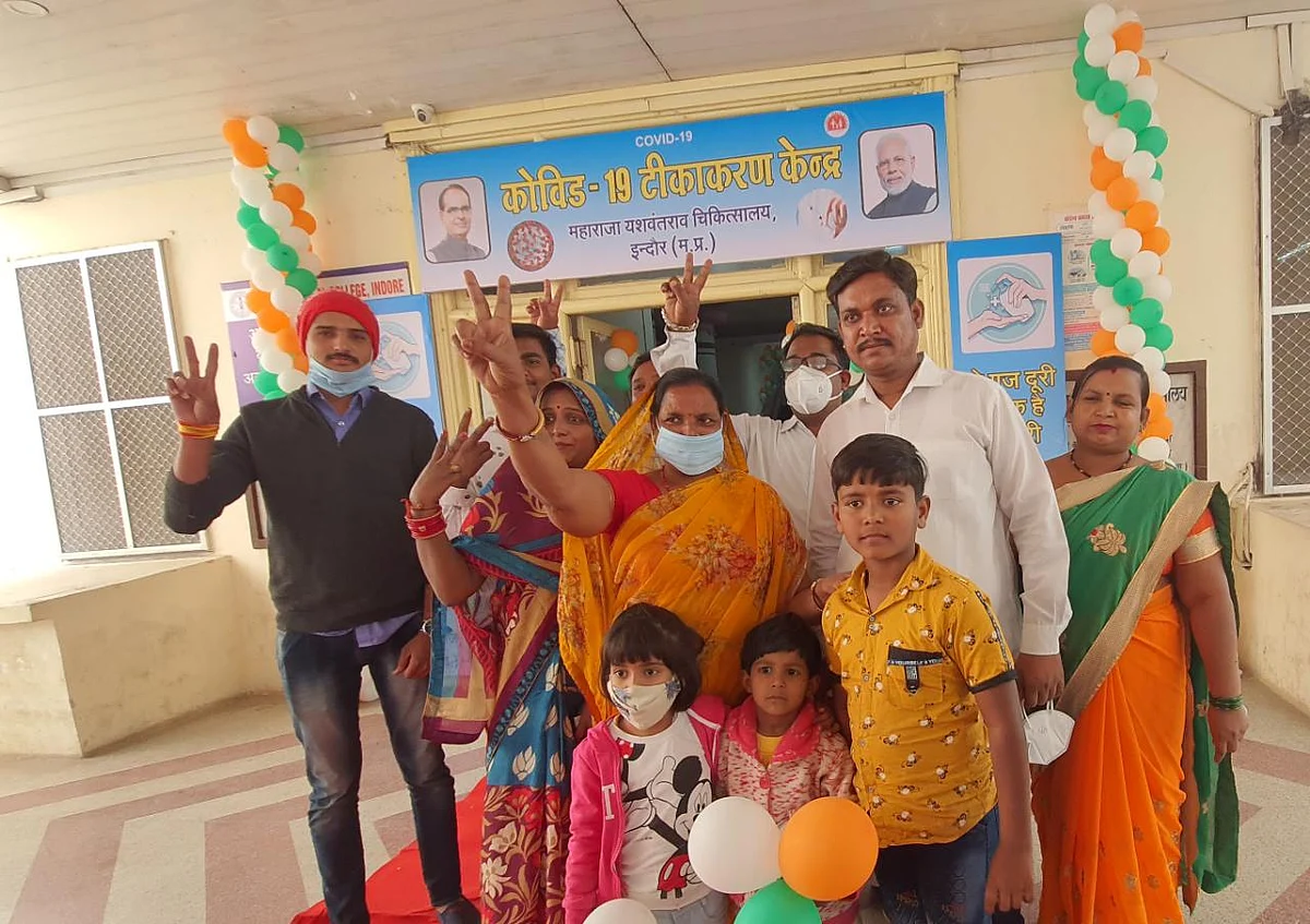 The family of district hospital staffer Asha Pawar outside MY hospital after she received the first hot