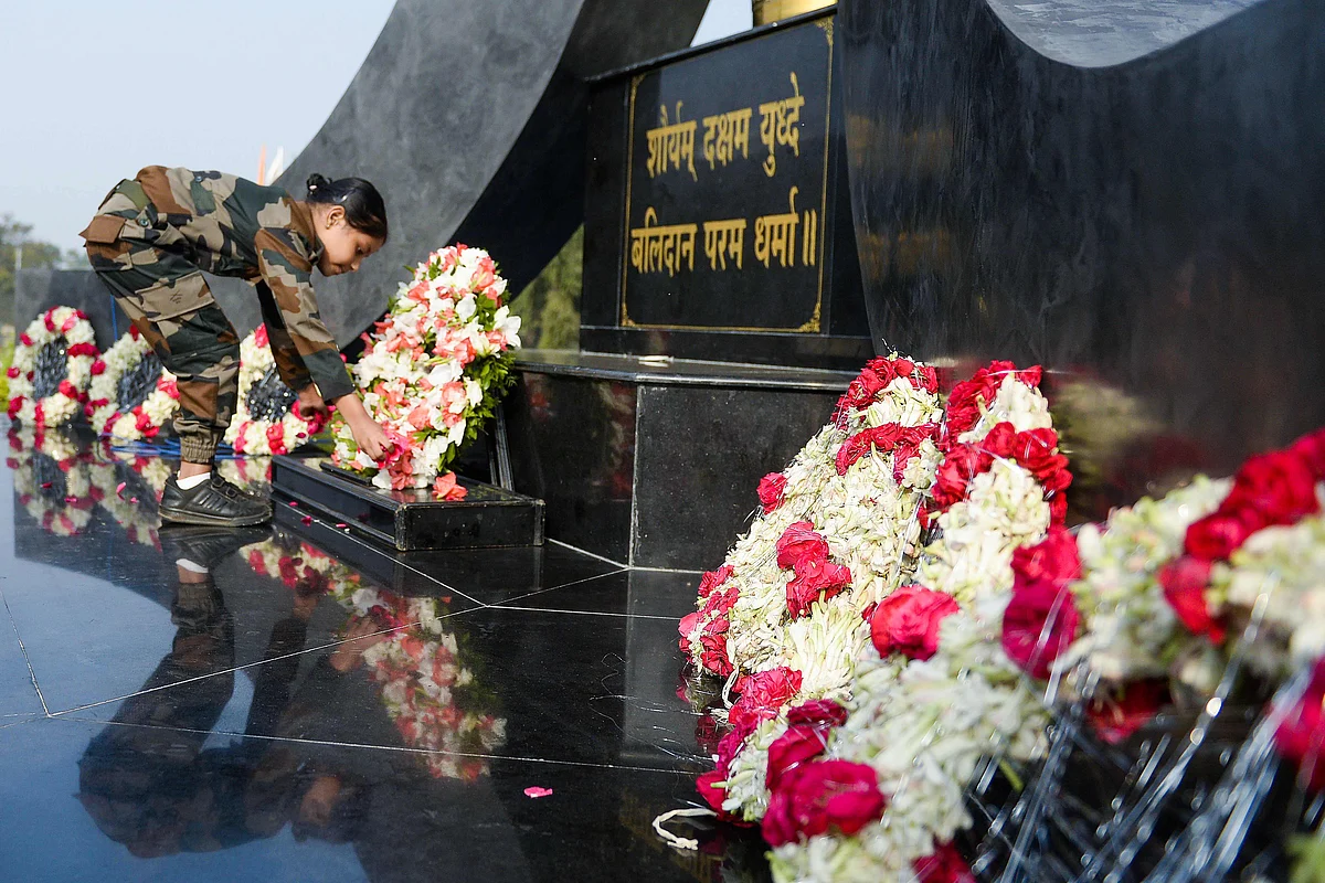 A girl wearing an Army uniform pays her tribute at a martyrs memorial to mark Indias 73rd Army Day in Secunderabad, the twin city of Hyderabad, on January 15, 2021