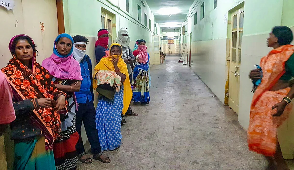 Women wait at Bhandara hospital where 10 babies died in a fire on Saturday