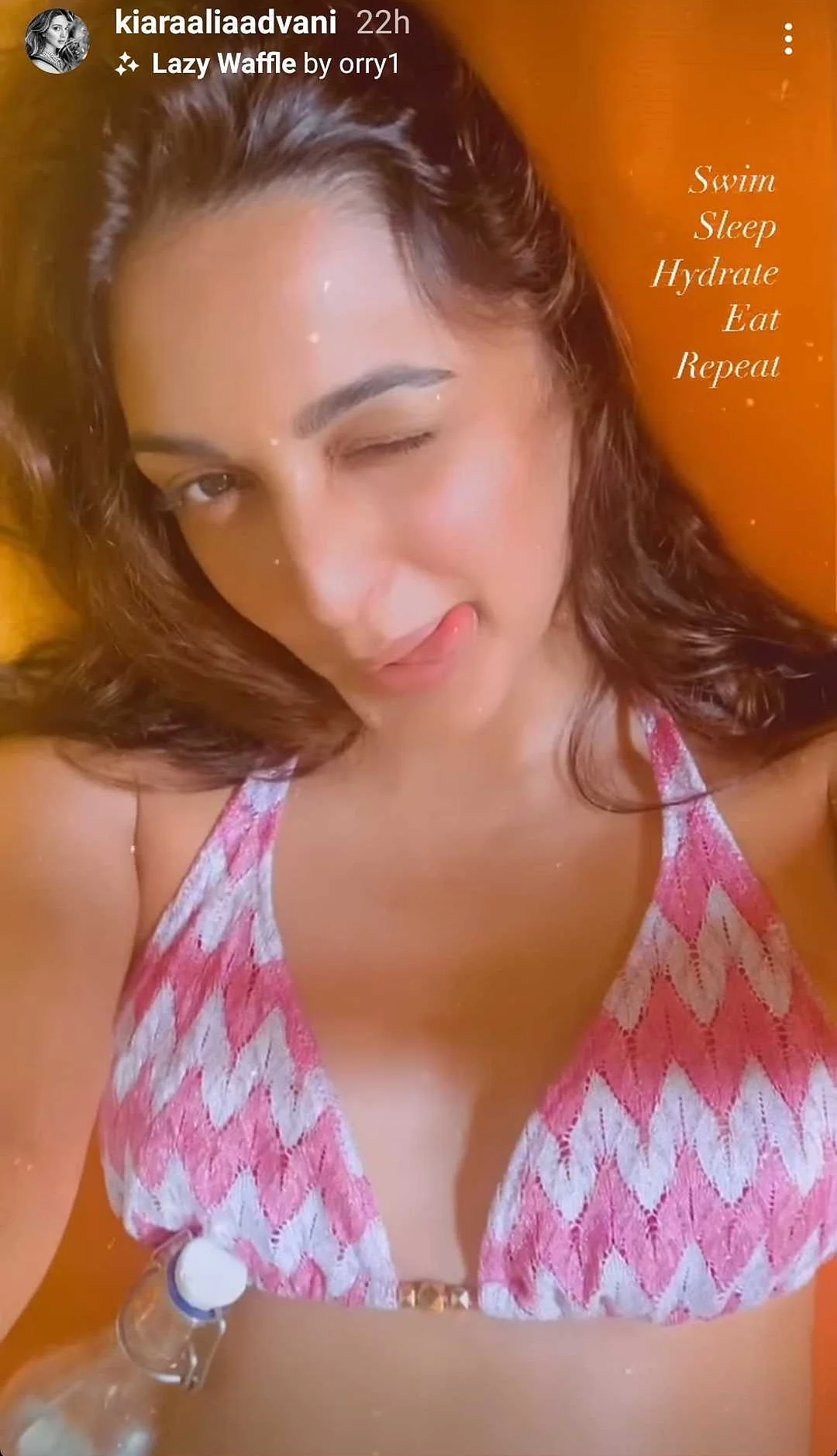 Kiara Advani flaunts her midriff in a strapless bikini while sunbathing in the Maldives