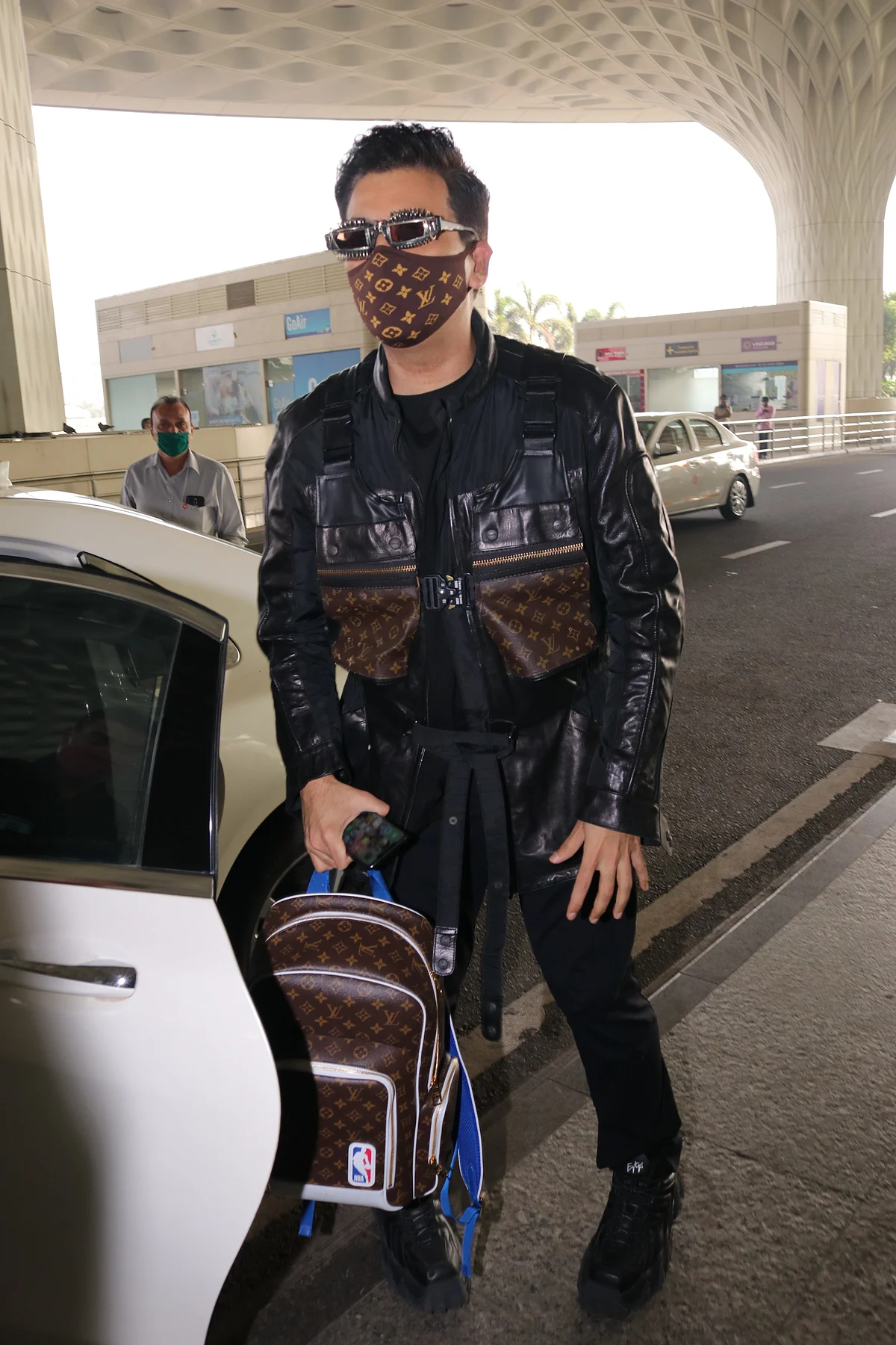 'Monkey, disaster, robot': Karan Johar trolled for his quirky Louis Vuitton airport look