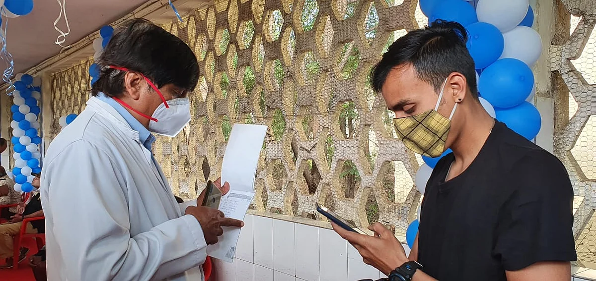 Checking before vaccination drive at ESIC Hospital in Nanda Nagar