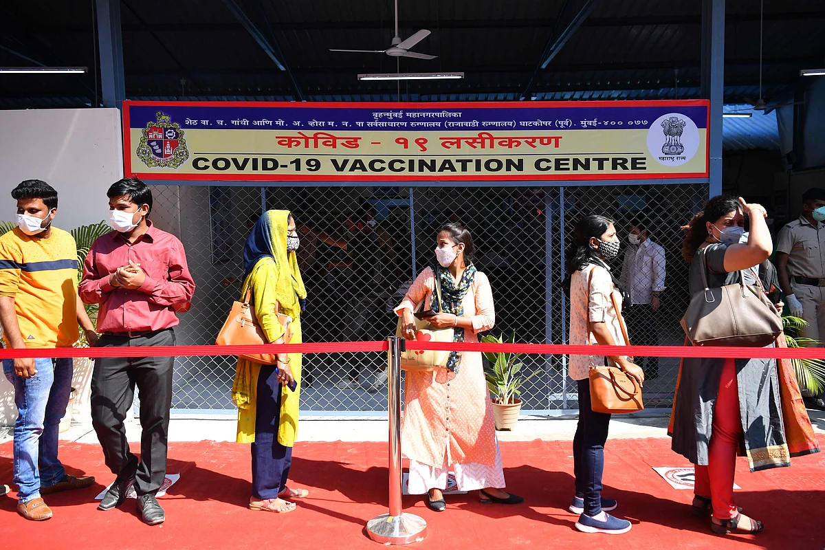 Health workers wait in line to receive a Covid-19 coronavirus vaccine in Mumbai on January 16, 2021.
