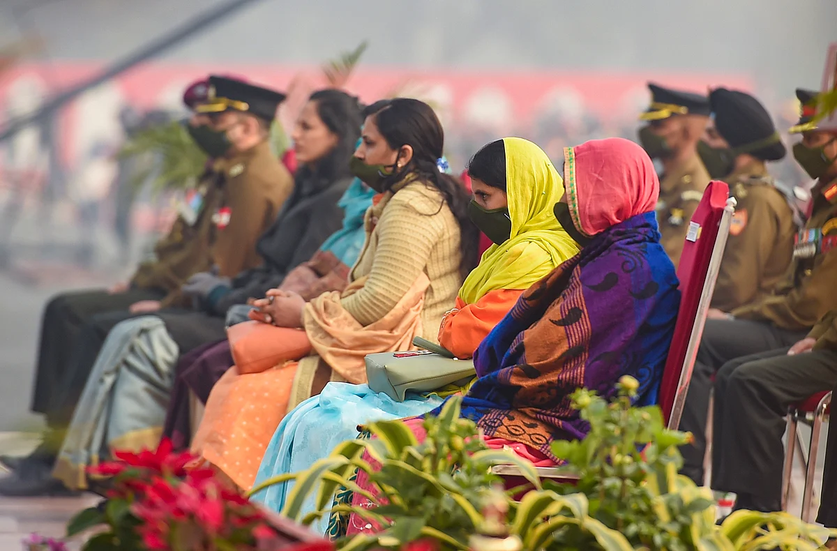 Widows of martyrs wait for the award distribution during the 73rd Army Day Parade, at Parade Ground in New Delhi, Friday, Jan. 15, 2021.