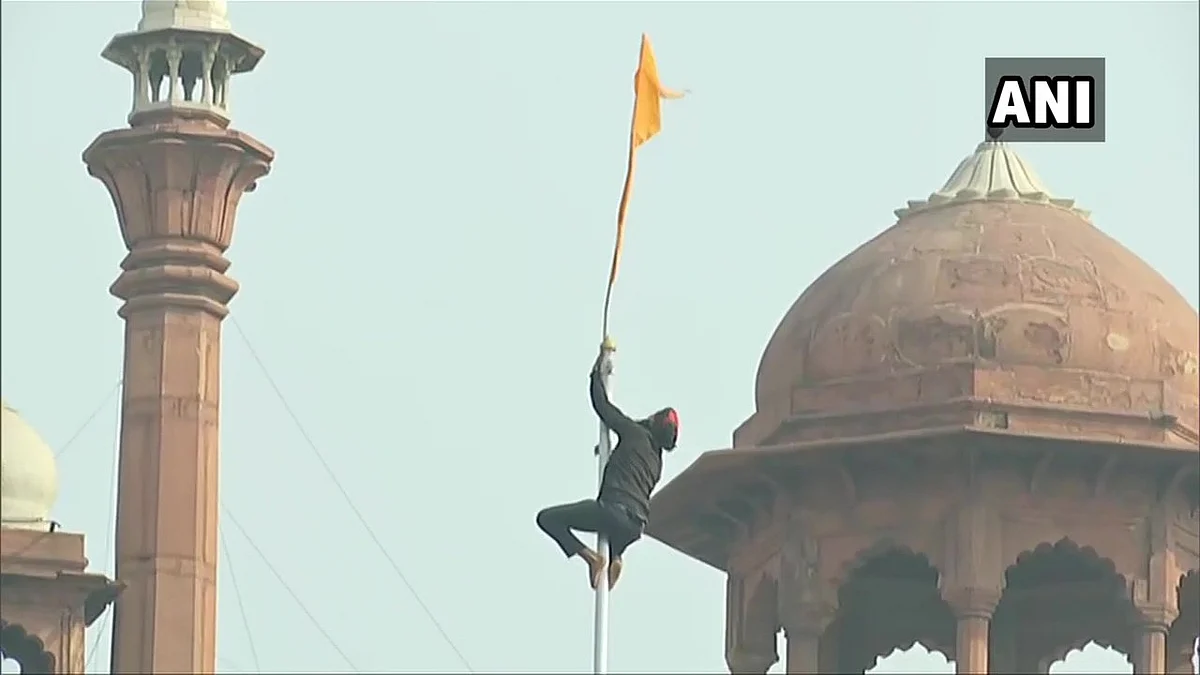 In Pics: Protesting farmers breach Red Fort, put up union flag, 'Nishan Sahib' at lower rampant