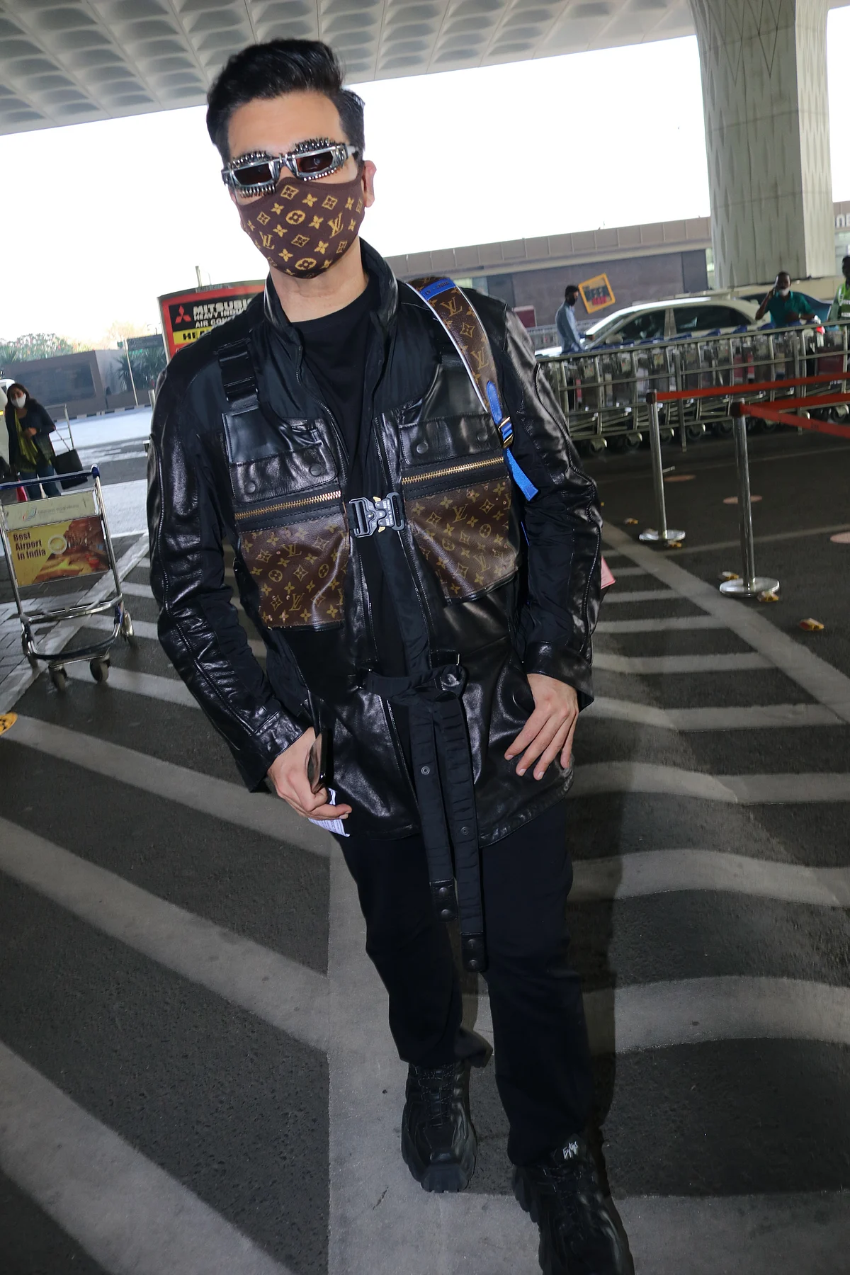 'Monkey, disaster, robot': Karan Johar trolled for his quirky Louis Vuitton airport look