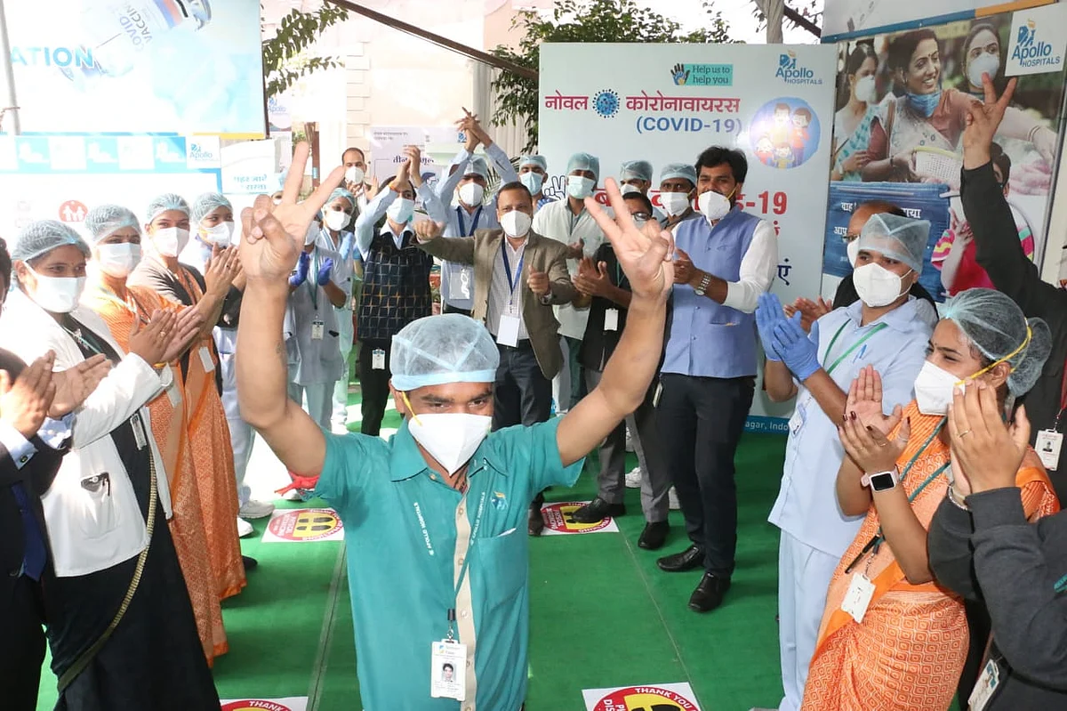 Apollo Hospital staffer Sunny Sunhare was welcomed by hospital staff after he received first vaccine