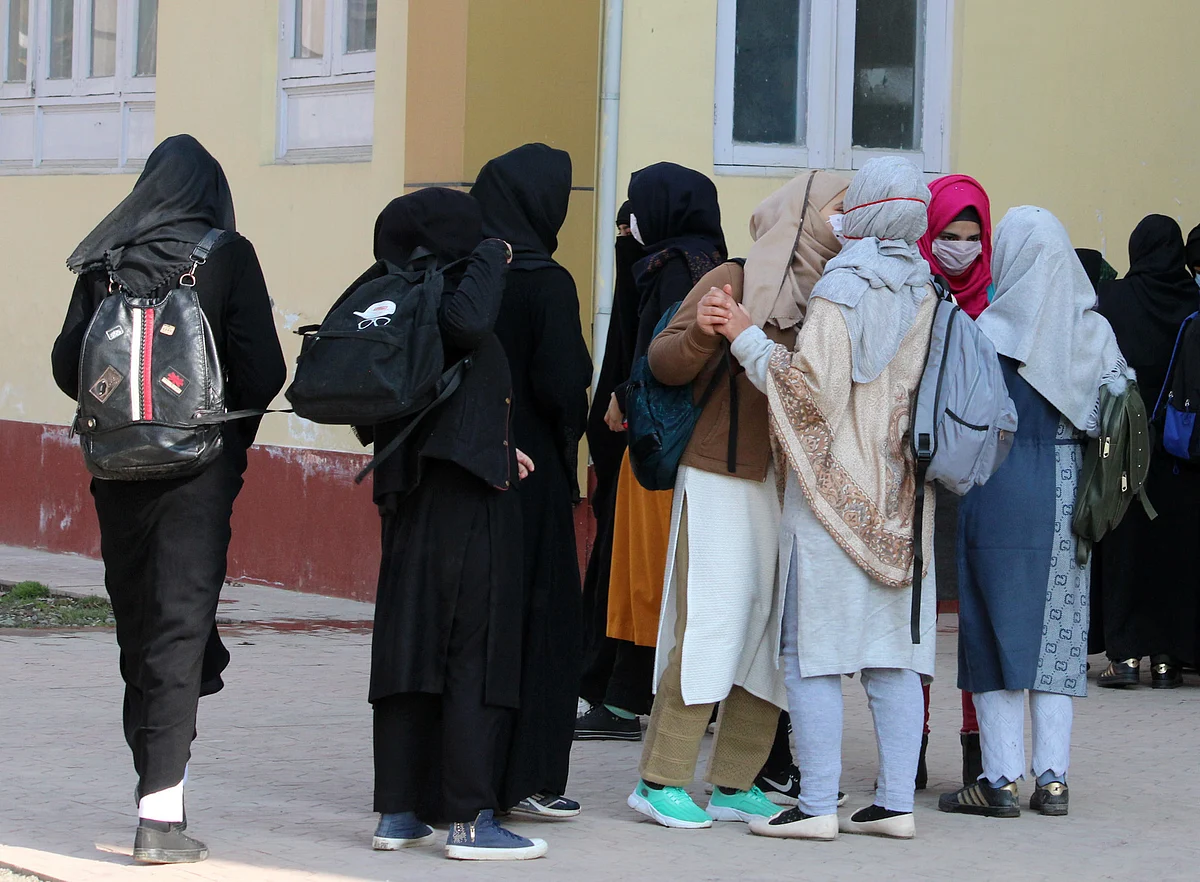Students arrive at a Government college as the Colleges reopened after almost 11 months of break due to the Covid-19 coronavirus pandemic in Srinagar, Kashmir on February 15, 2021.
