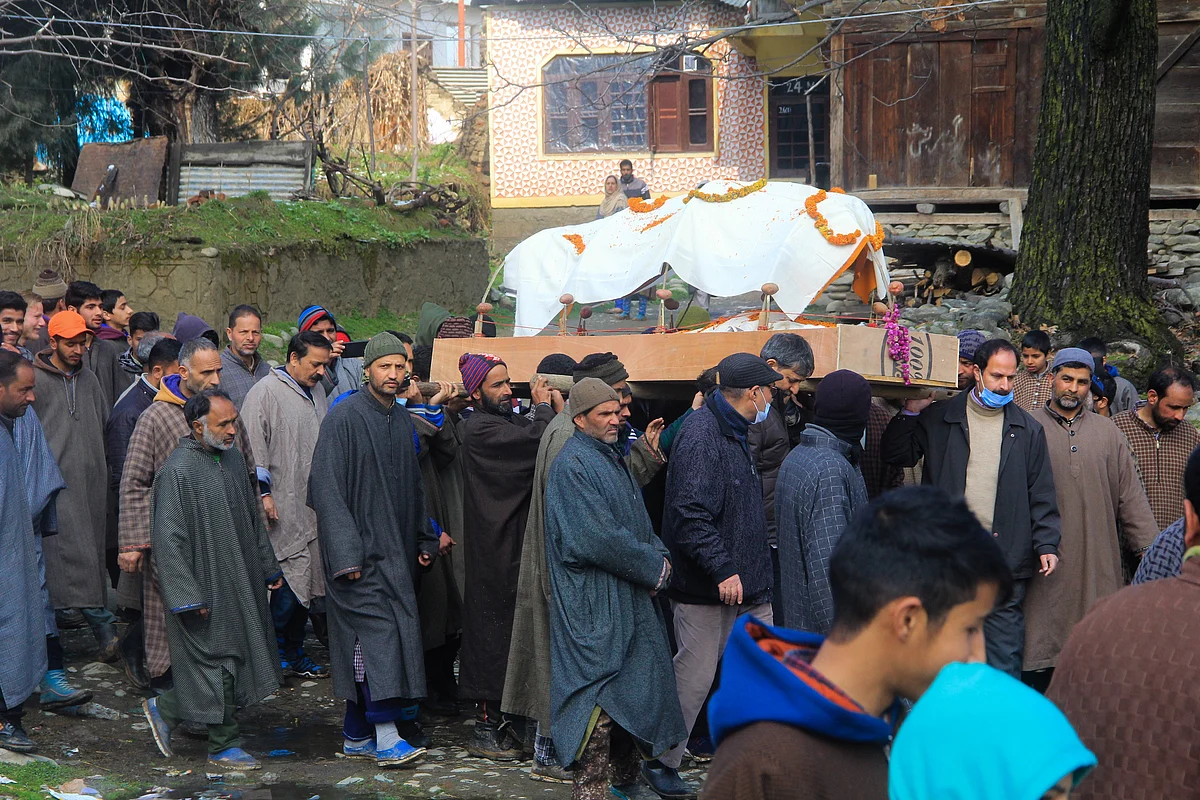 Local Muslims help perform last rites of centenarian Kashmiri Pandit woman in Kunzer village of Jammu and Kashmir.