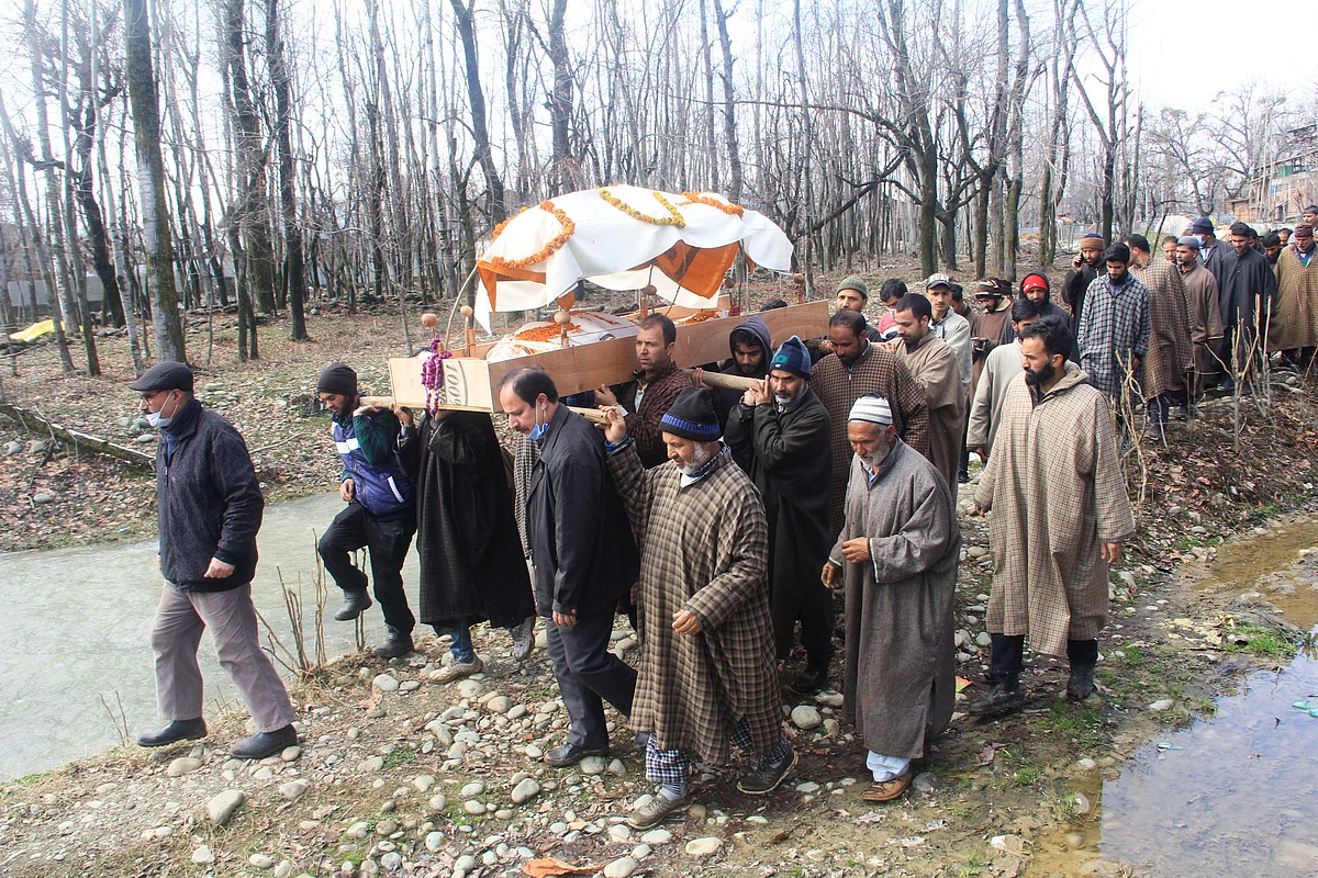 Muslims help Pandits perform last ritesof deceased Kashmiri Pandit woman at Kunzer Village of Baramulla District of Kashmir.
