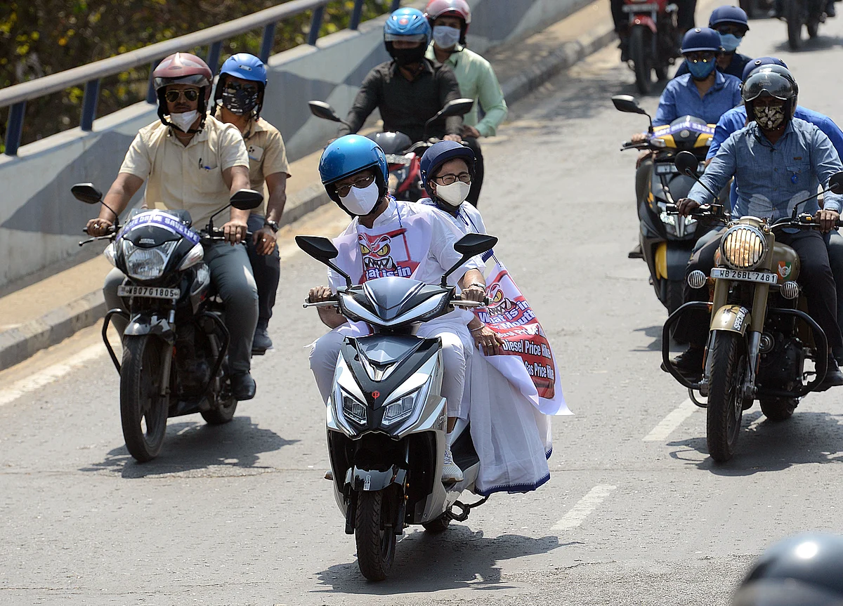 Banerjee was seen sitting behind state minister Firhad Hakim, who rode the battery-powered electric scooter