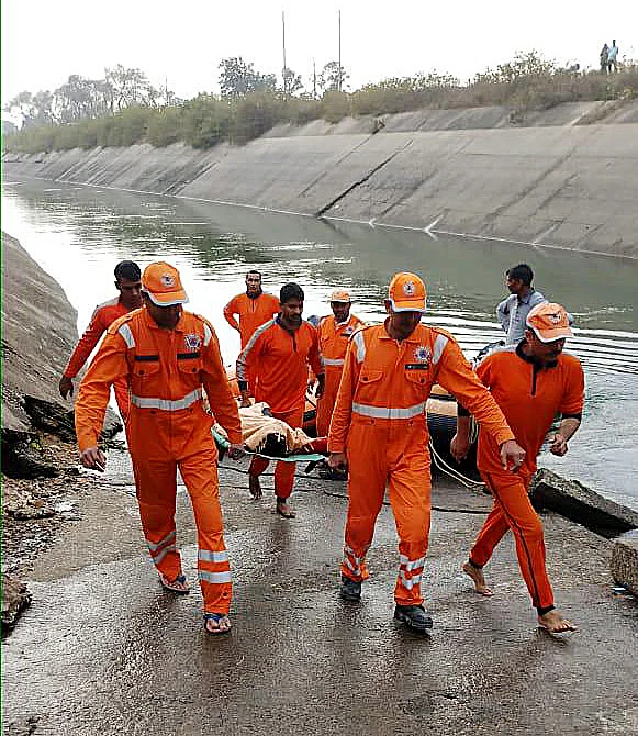 NDRF team carries out rescue operations after an bus plunged into a canal in Sidhi district, Madhya Pradesh on Tuesday.