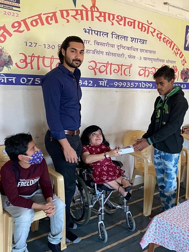 Visually impaired boy receiving smart phone