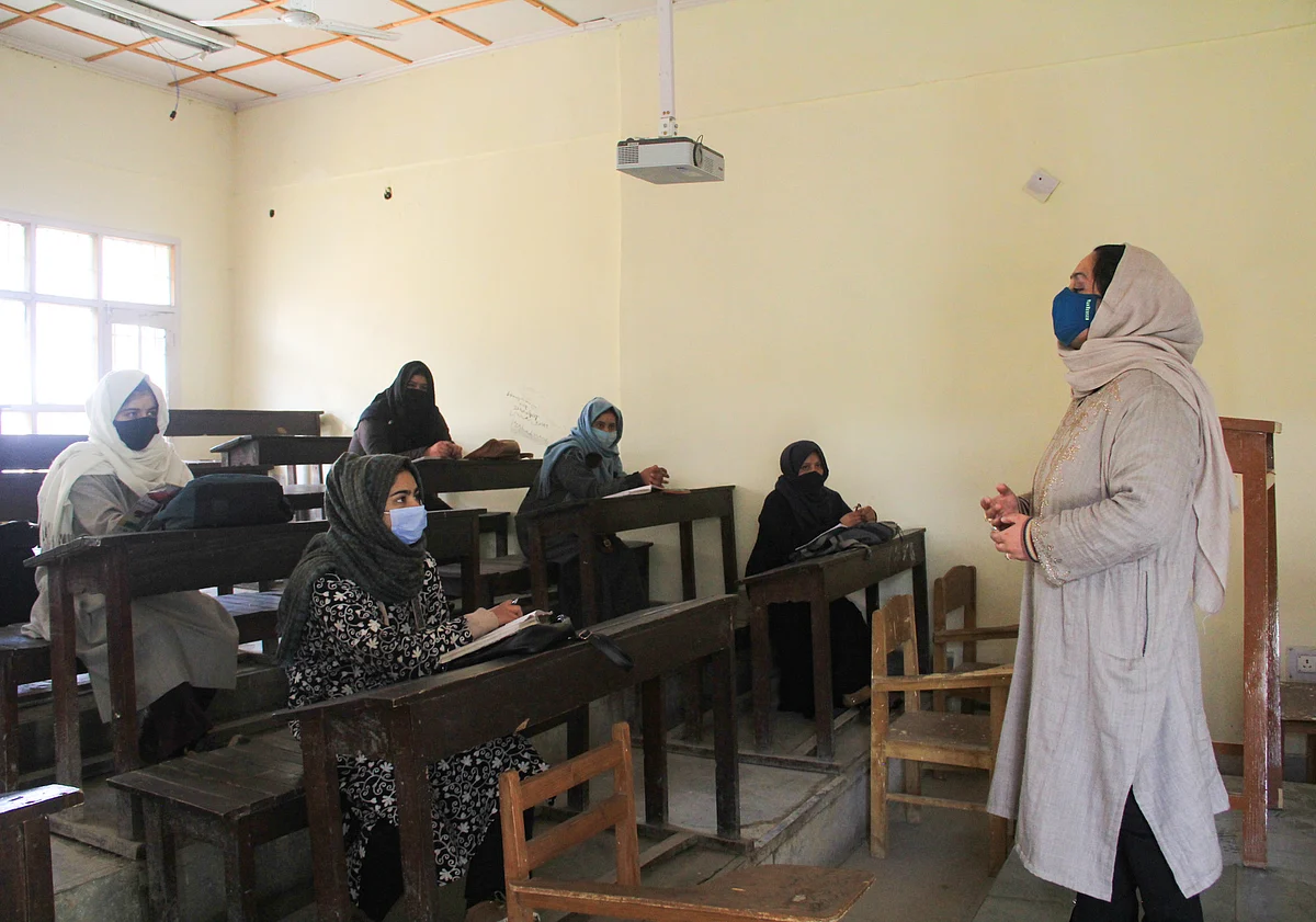 A teacher takes a class at a College that was reopened after remaining shut since March 19, 2020 due to coronavirus pandemic, in Srinagar, Kashmir.