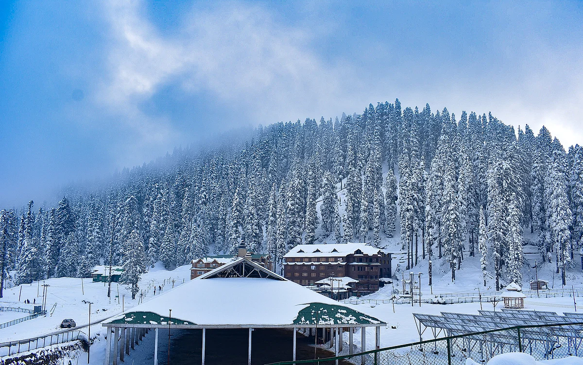 A general view of the snow- covered hotel and trees at a famous ski- resort in Gulmarg.