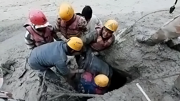 ITBP personnel rescue one person who was trapped in the tunnel near Tapovan dam, in Chamoli on Sunday.