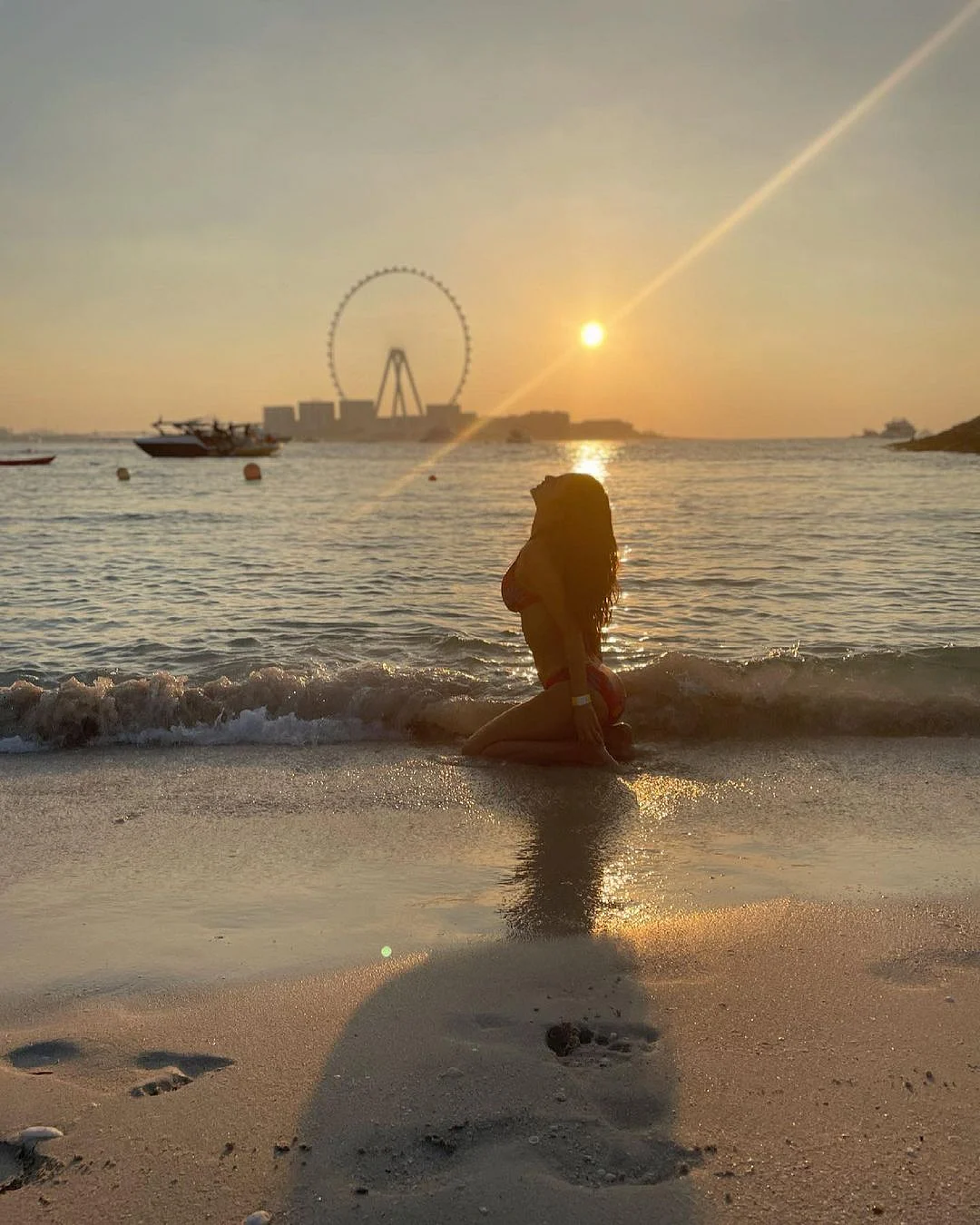 Mouni Roy looks ravishing in a hot red bikini as she enjoys a day at the beach
