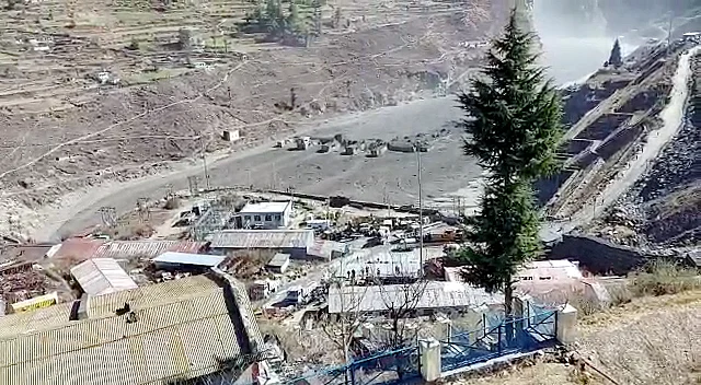 A massive flood in Dhauliganga seen near Reni village, where some water body flooded and destroyed many river bankside houses due to cloudburst or breaching of the reservoir on Sunday.