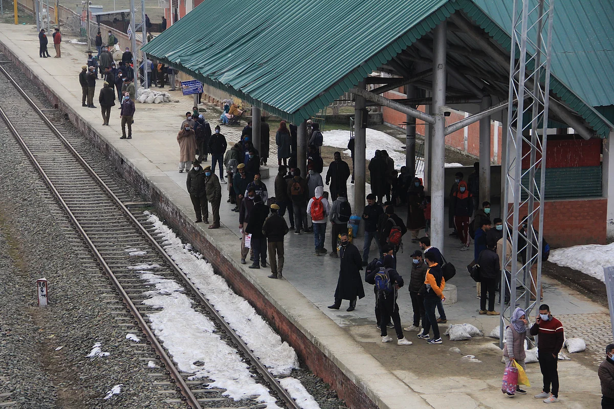 Passengers waiting for a train as the rail service connecting Banihal to Baramulla resumed, in Kashmir on Monda. After remaining suspended for 11 months due to the pandemic
