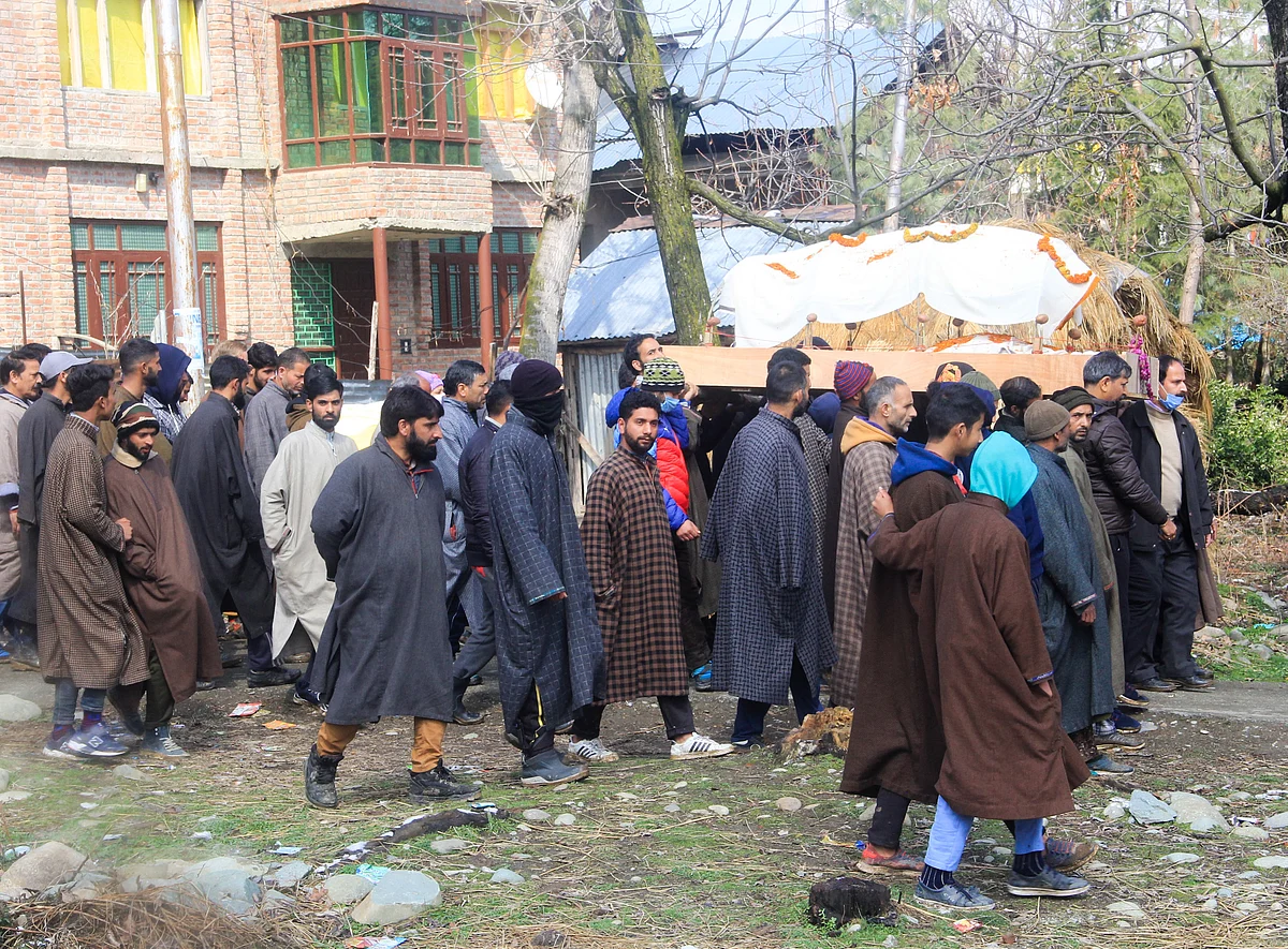 Muslims carry the body of Kashmiri pandit woman in Kunzer Village of Jammu and Kashmir.