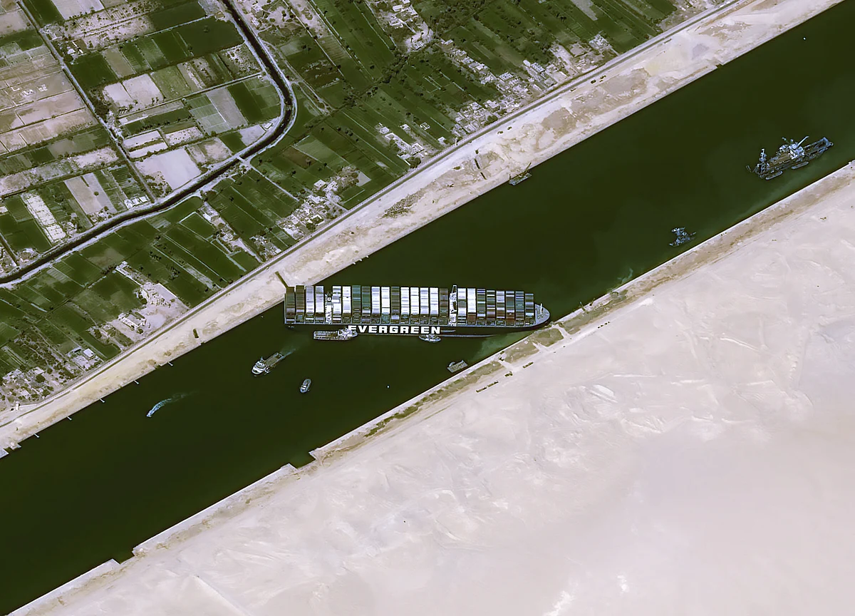 This handout satellite images courtesy of Cnes 2020 released on March 25, 2021 by Airbus DS shows the Taiwan-owned MV Ever Given lodged sideways and impeding all traffic