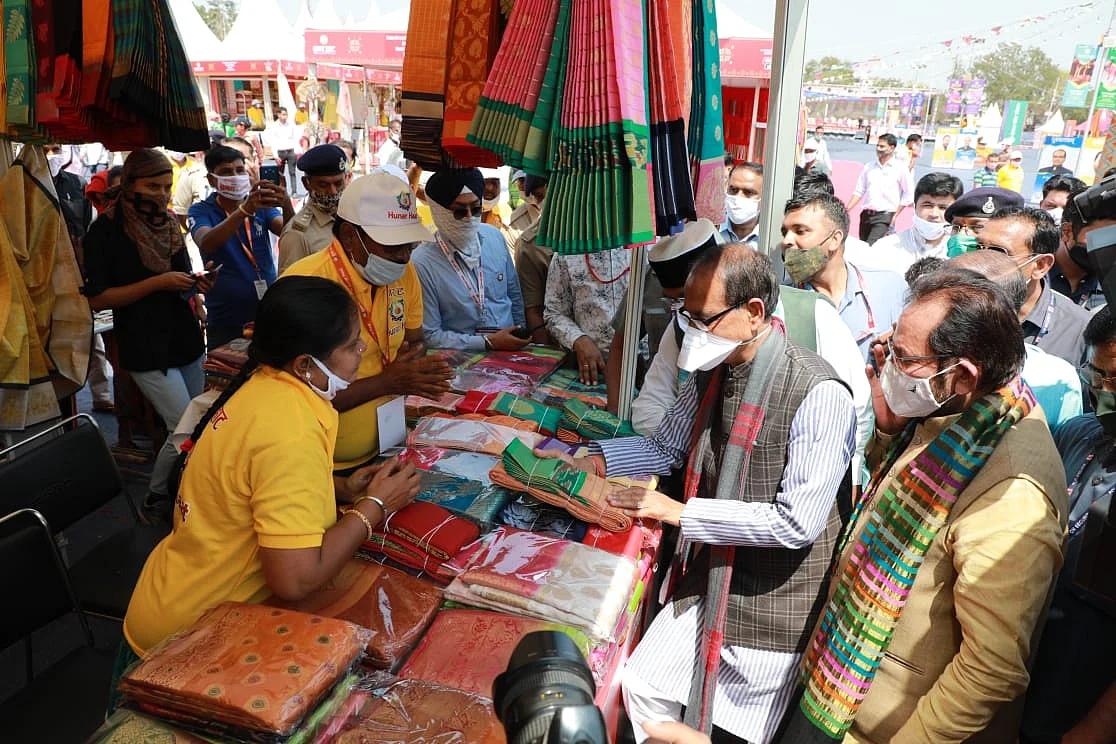 Chief minister Shivraj Singh Chouhan, Union Minister for Minority Affairs Mukhtar Abbas Naqvi look at products at Hunar Haat