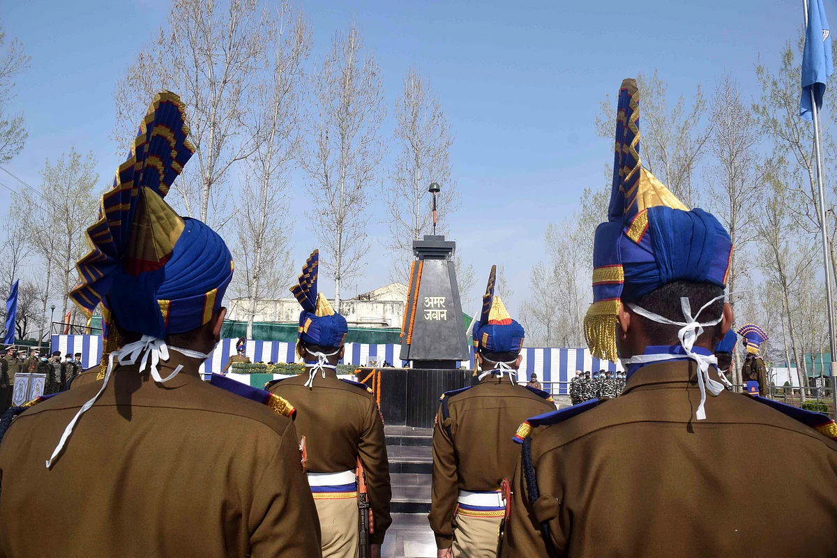 CRPF personnel pay tribute to their two colleagues, who were killed in a militant attack at Pampore yesterday, during a wreath laying ceremony at Humahama on the outskirts of Srinagar.